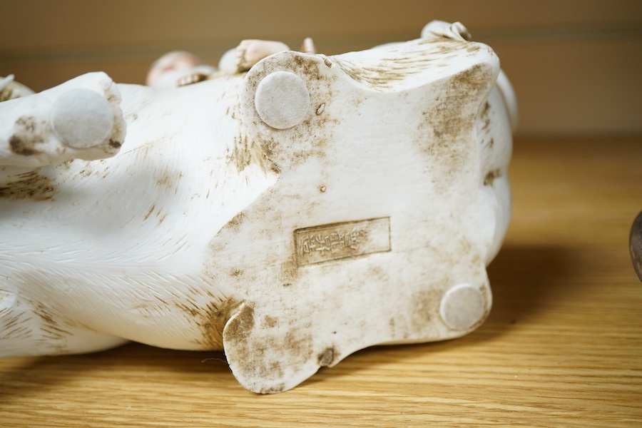 A Chinese Shiwan pottery pod shaped 'frog' vase - 32cm high including stand and a biscuit buffalo group (2)